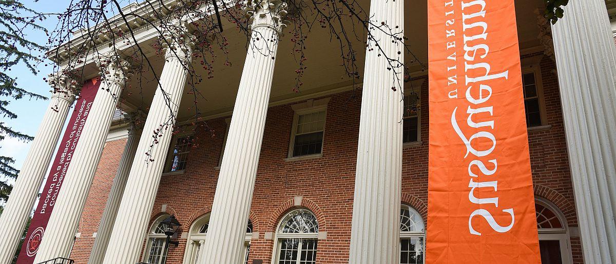 Image of Seibert Hall, columns and Susquehanna banner in foreground.